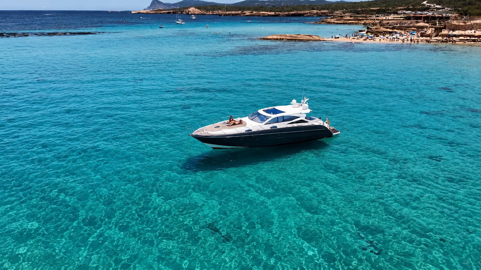 Turquoise water of Ibiza's west coast seen from the yacht